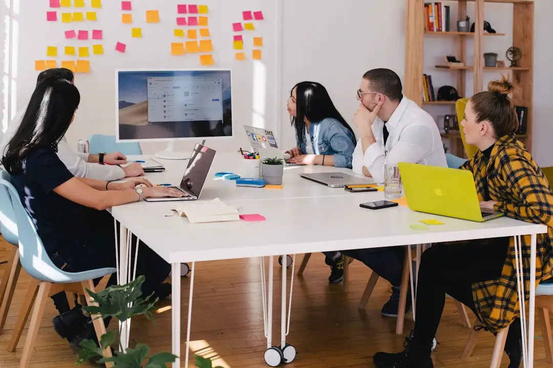 A team in an office discussing sales enablement during a meeting