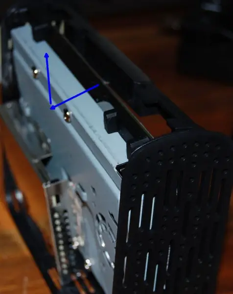 Rotate the hard drive/carrier assembly sideways and then lift away from the case